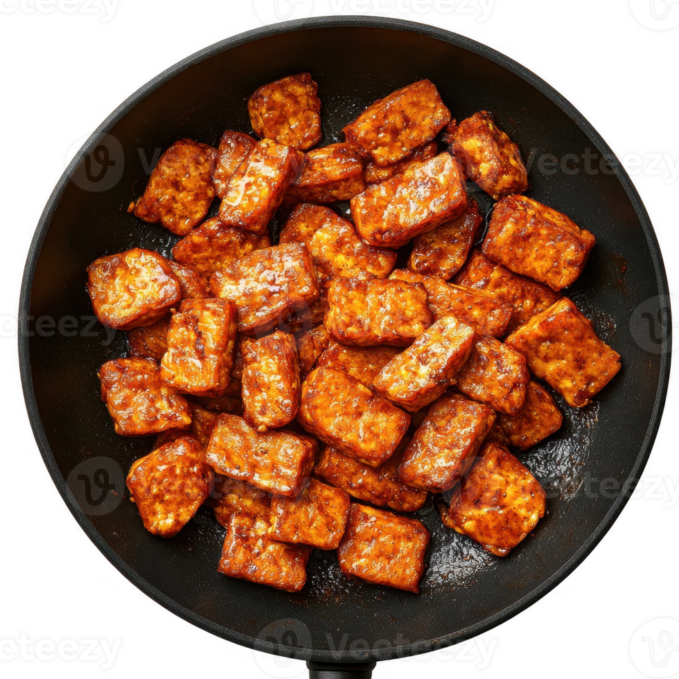 Delicious fried tofu cubes coated in savory sauce, served in a hot skillet. png