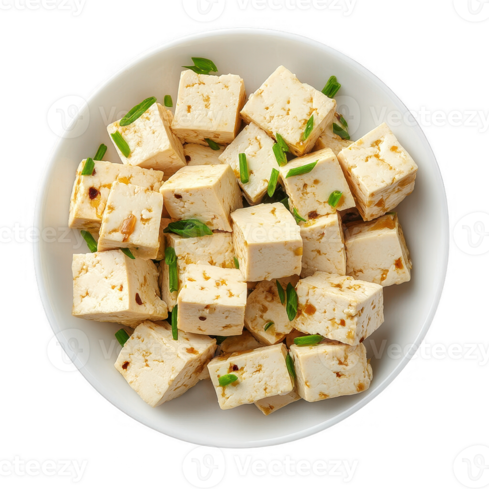 Freshly prepared tofu cubes garnished with green onions in a white bowl. png