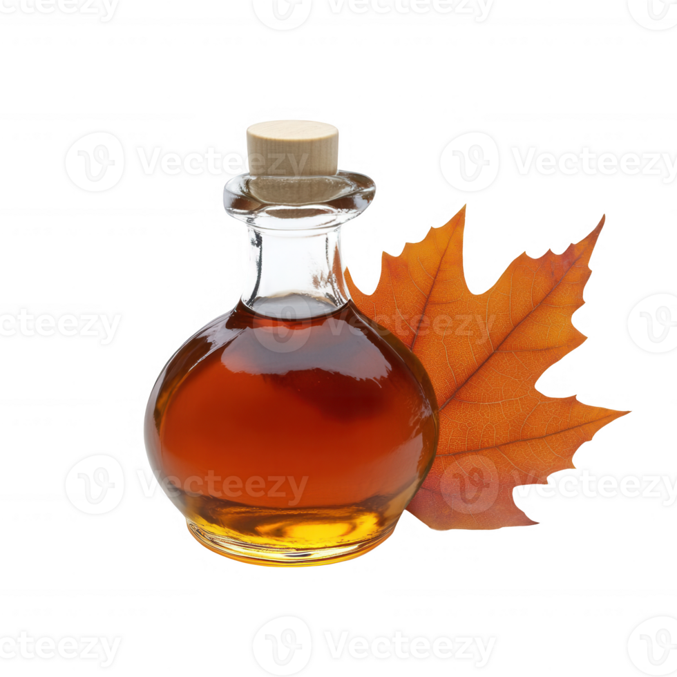 A bottle of maple syrup beside a vibrant autumn leaf. png
