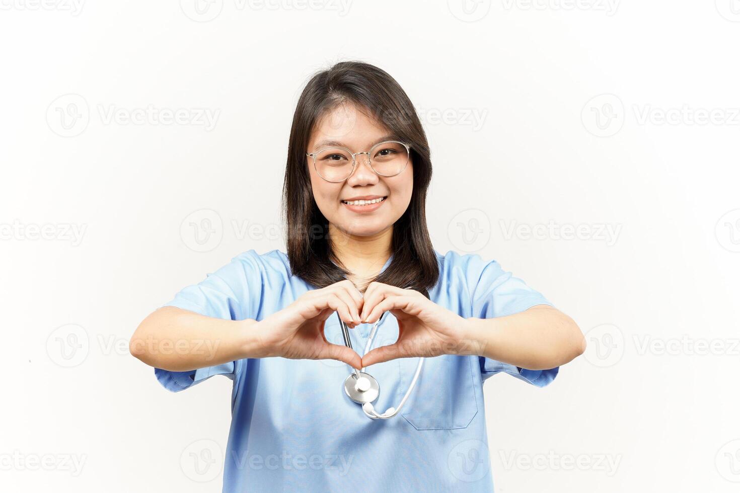 Showing Love Sign Of Asian Young Doctor Isolated On White Background photo