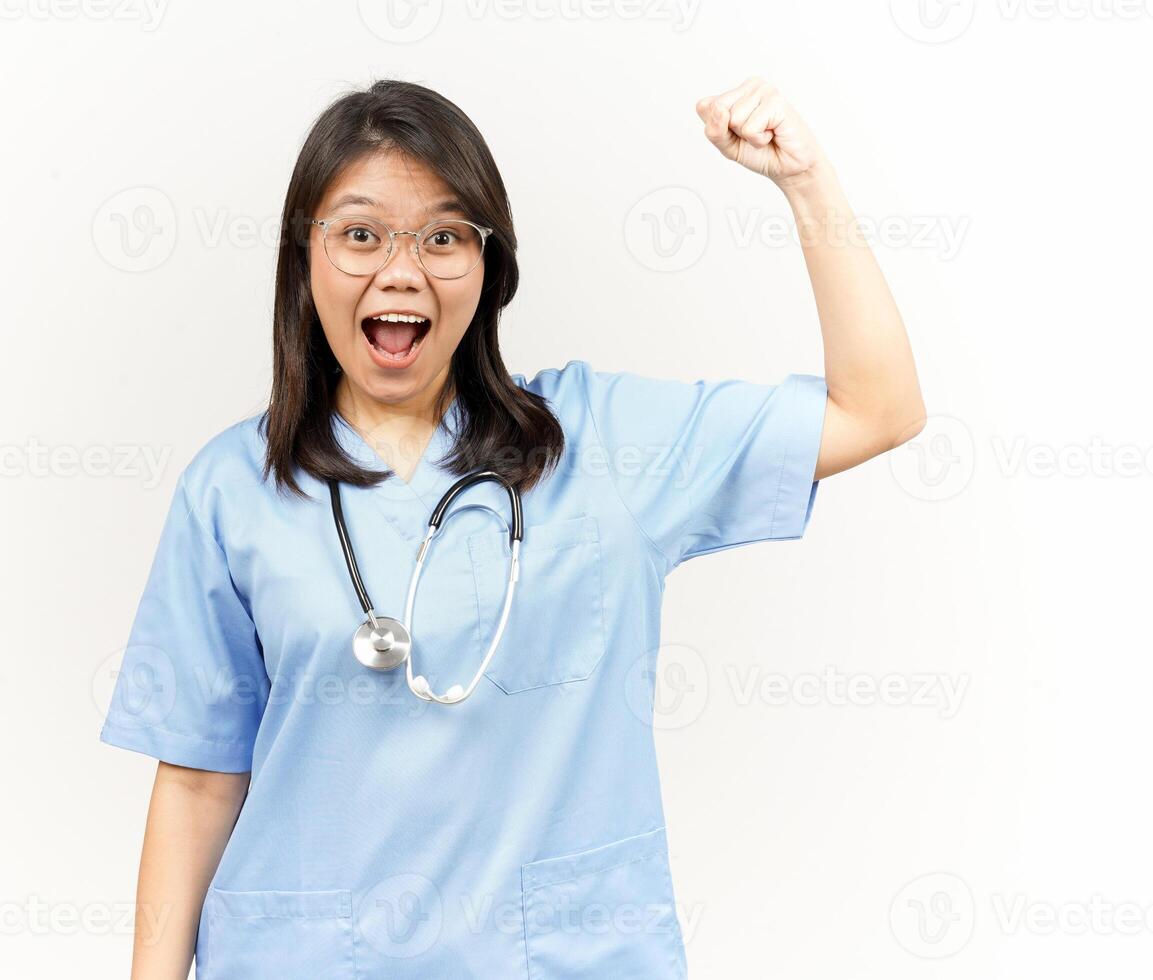 Showing Strength Arms Of Asian Young Doctor Isolated On White Background photo