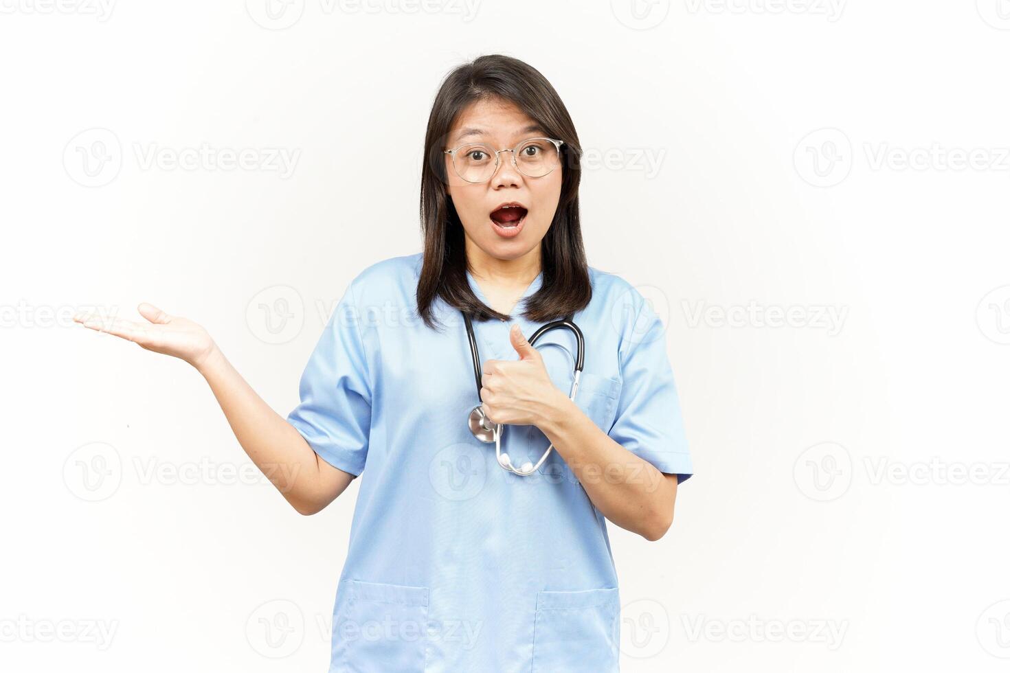 Showing and Presenting Product on Open Palm Of Asian Young Doctor Isolated On White Background photo