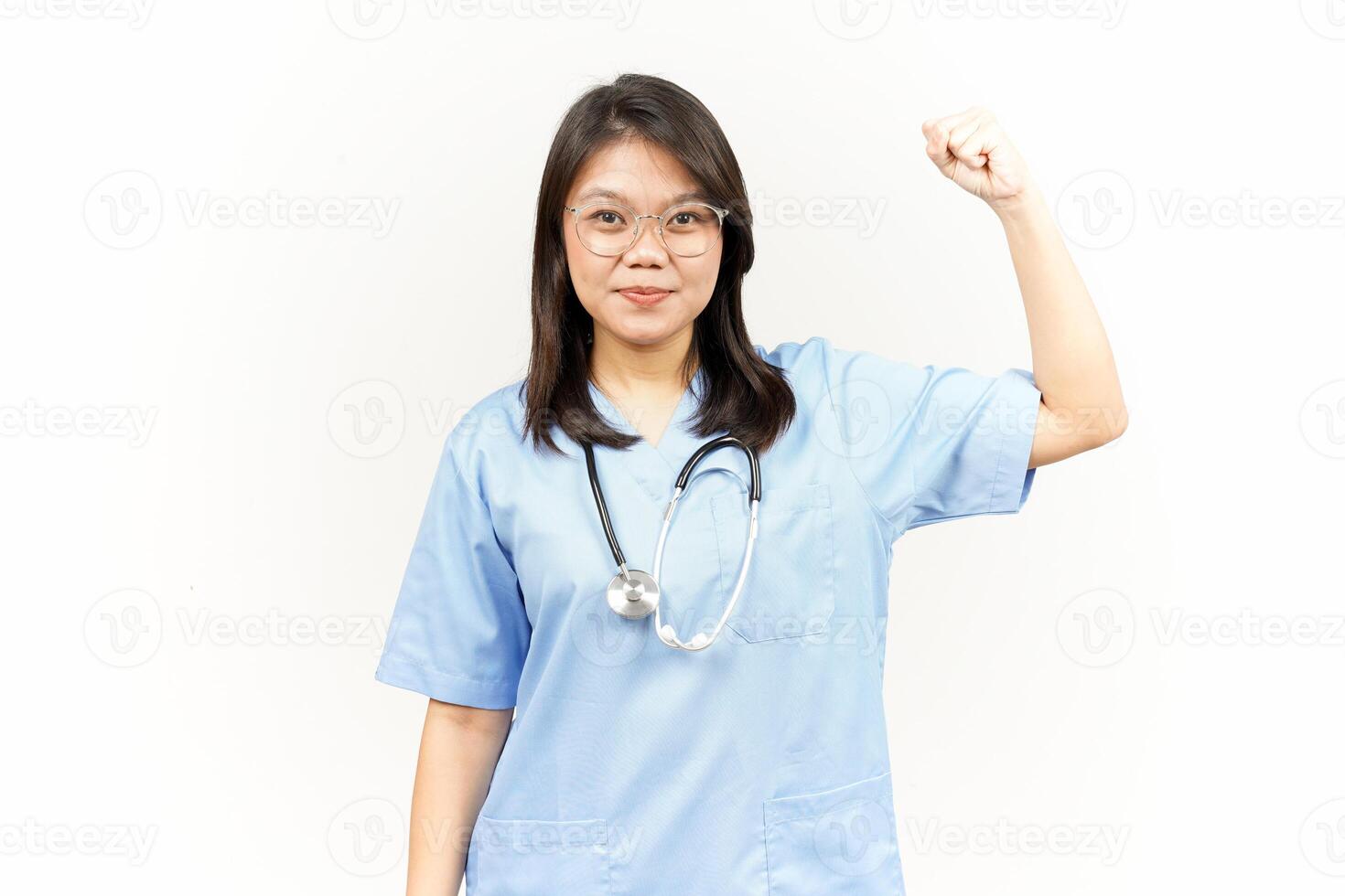 Showing Strength Arms Of Asian Young Doctor Isolated On White Background photo