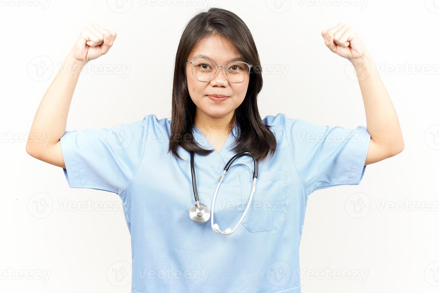 Showing Strength Arms Of Asian Young Doctor Isolated On White Background photo
