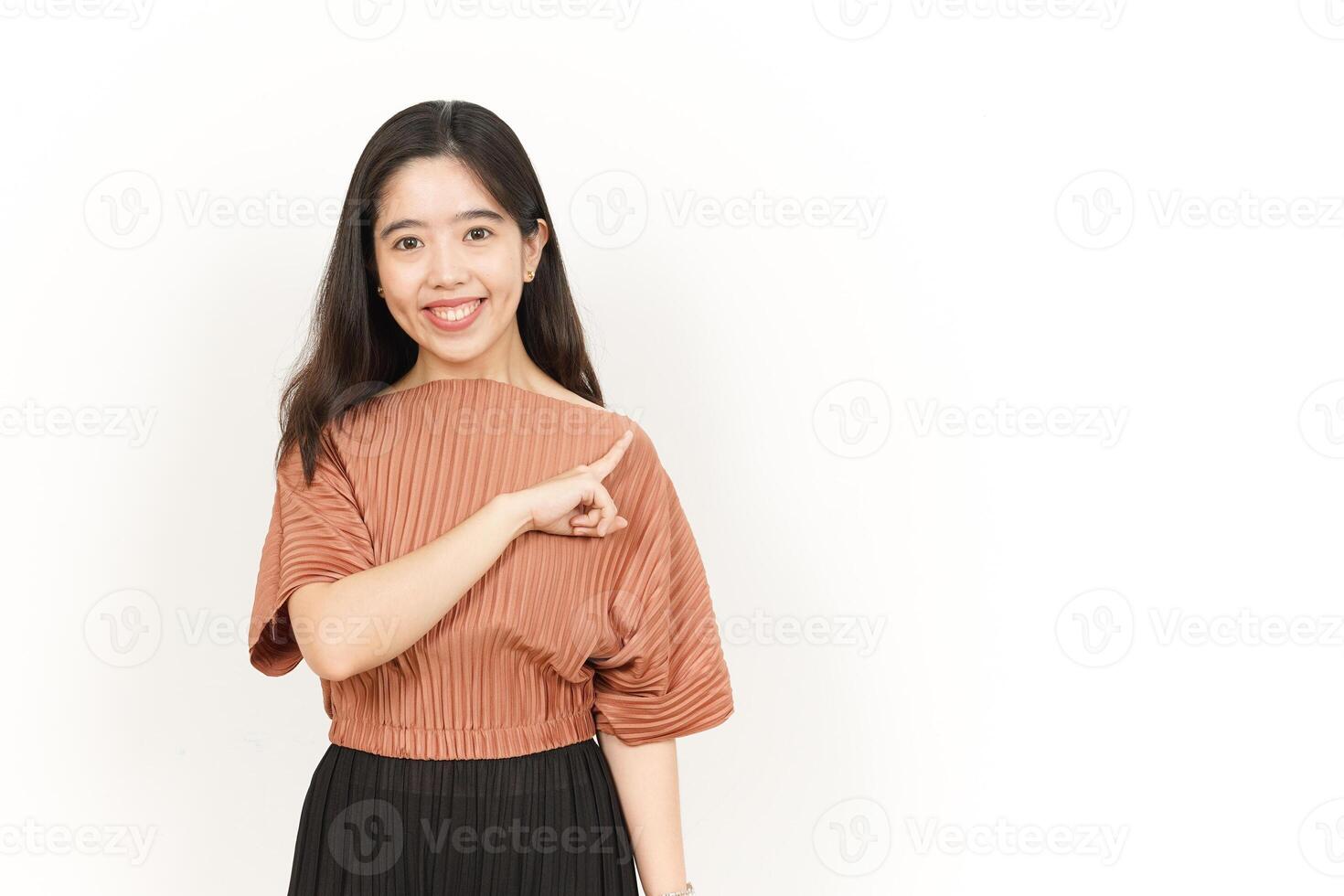 Pointing Product On The Side Of Beautiful Asian Woman Isolated On White Background photo
