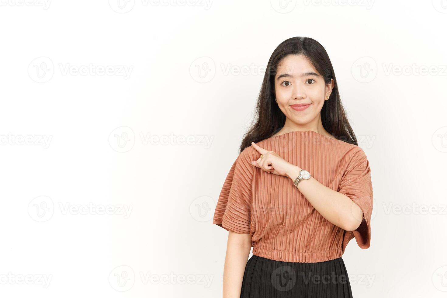 Pointing Product On The Side Of Beautiful Asian Woman Isolated On White Background photo