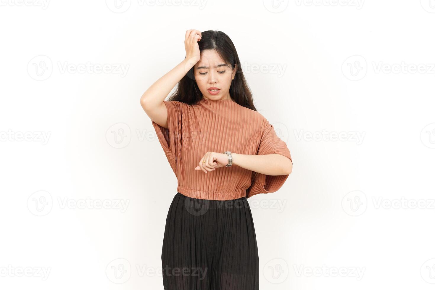 Looking at the watch and get late Of Beautiful Asian Woman Isolated On White Background photo