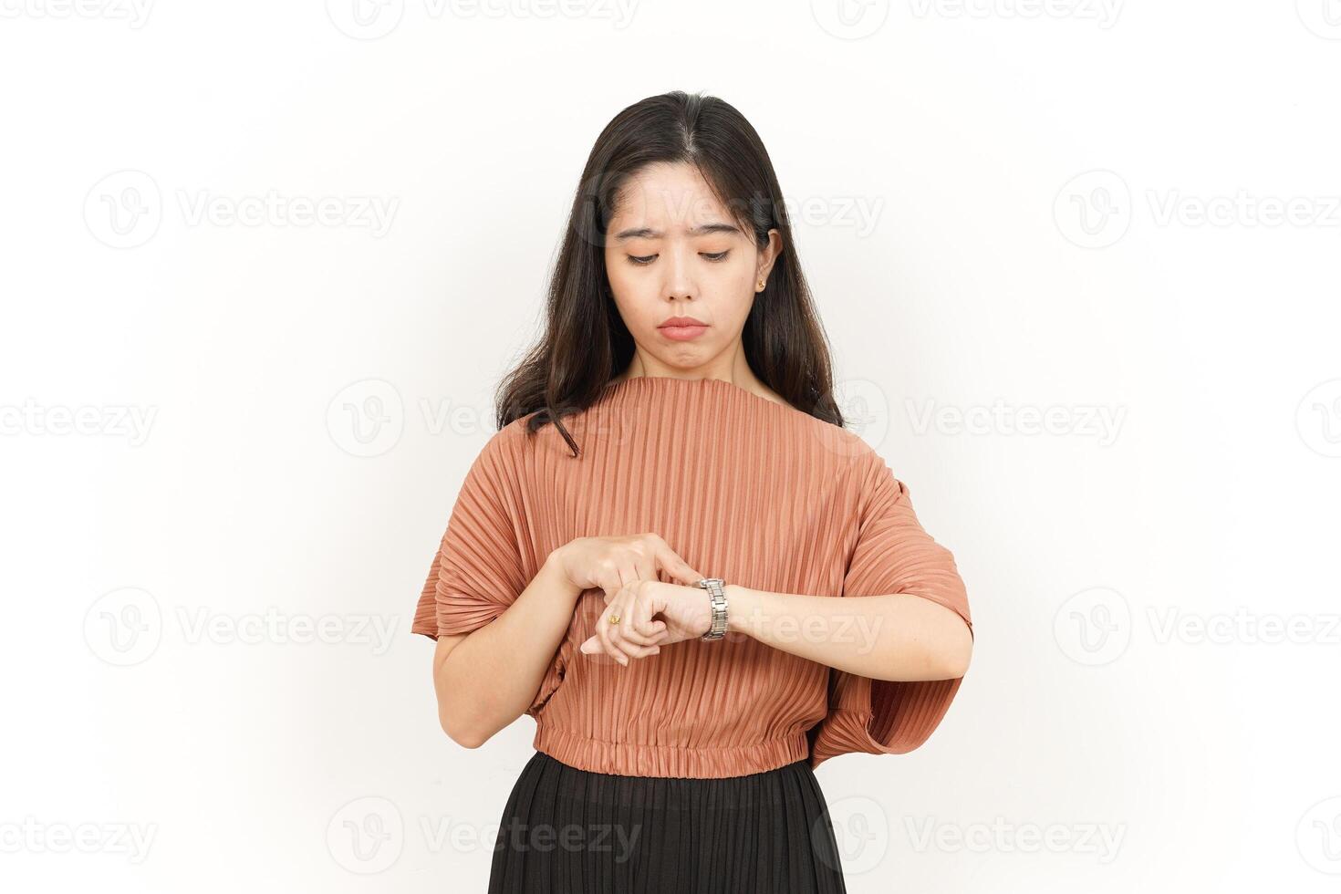 Looking at the watch and get late Of Beautiful Asian Woman Isolated On White Background photo