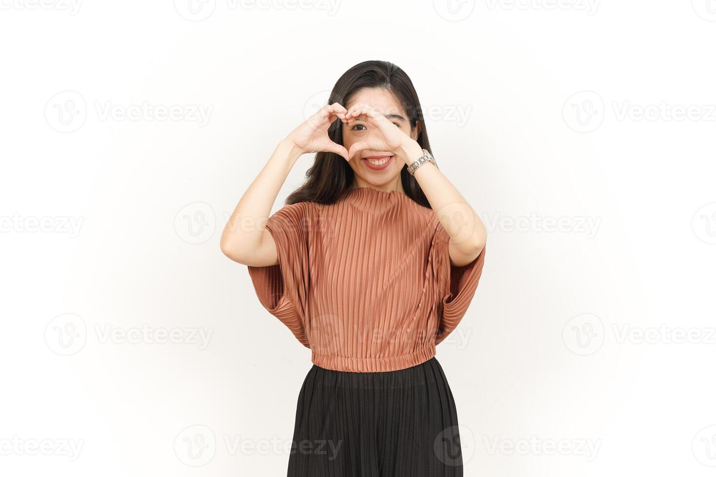 Showing Love Sign Of Beautiful Asian Woman Isolated On White Background photo