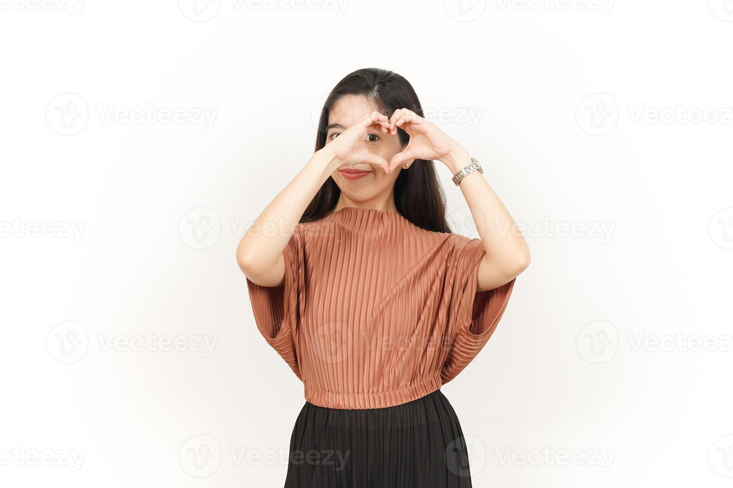 Showing Love Sign Of Beautiful Asian Woman Isolated On White Background photo