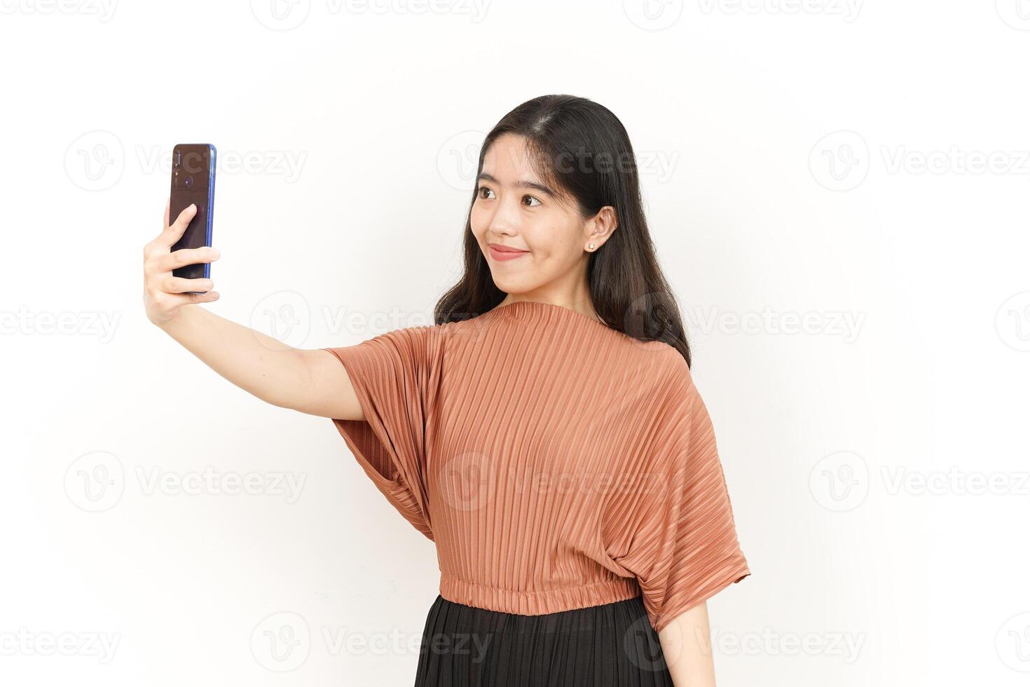 Take a Selfie Of Beautiful Asian Woman Isolated On White Background photo