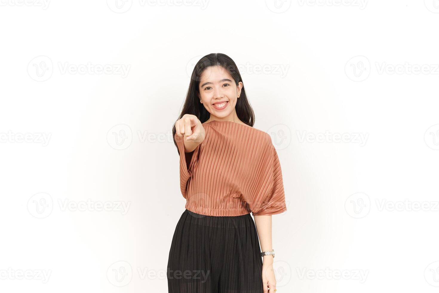 Smile and Pointing at Camera, Want You Gesture Of Beautiful Asian Woman Isolated On White Background photo