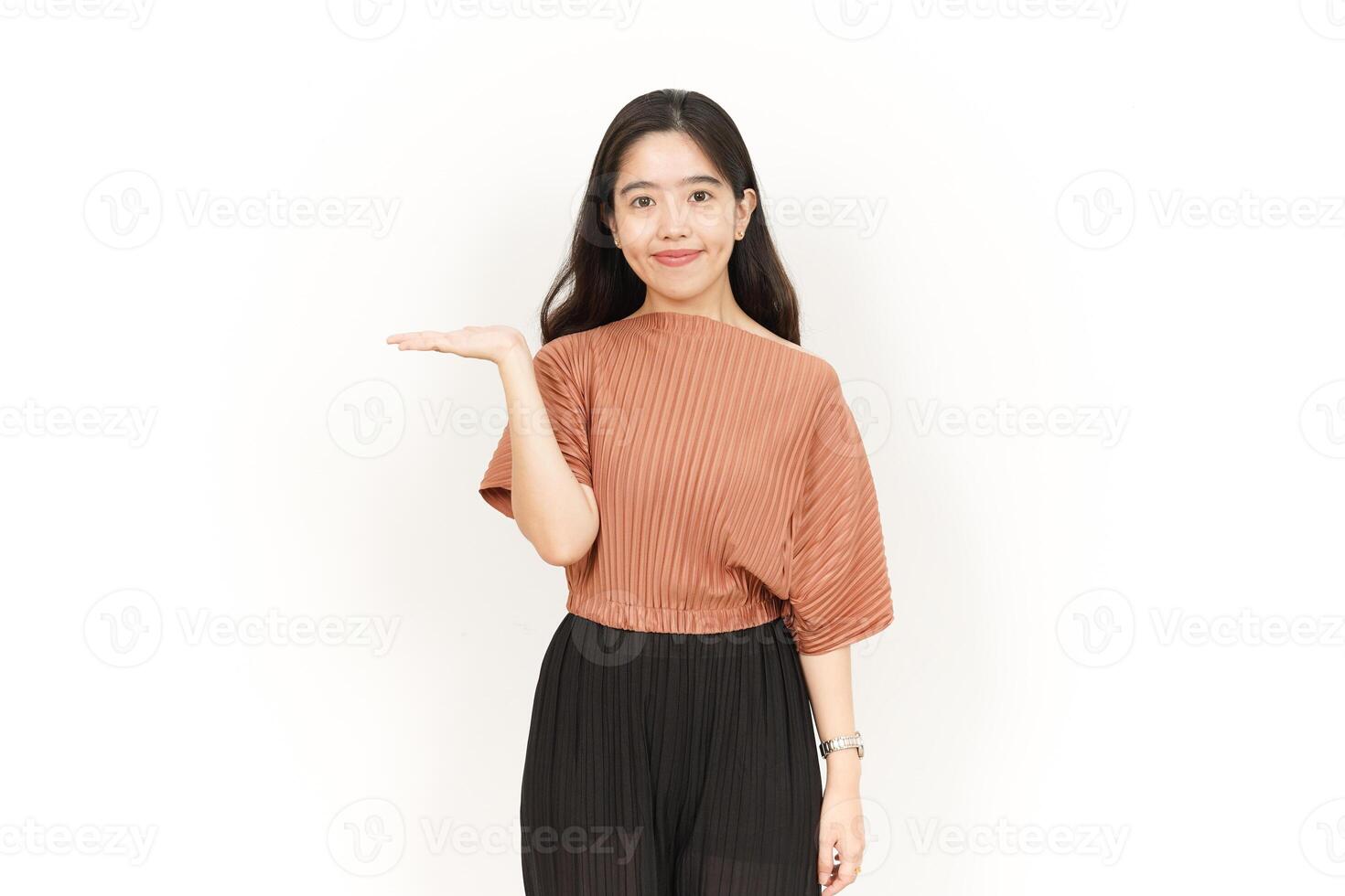 Showing and Presenting Product on Open Palm Of Beautiful Asian Woman Isolated On White Background photo