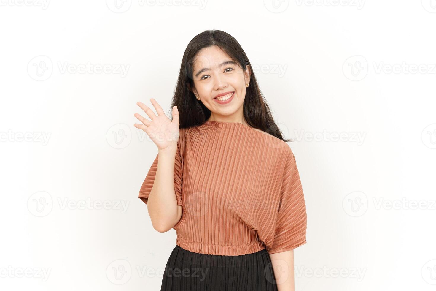 Hi Greeting or Waving at Camera Of Beautiful Asian Woman Isolated On White Background photo