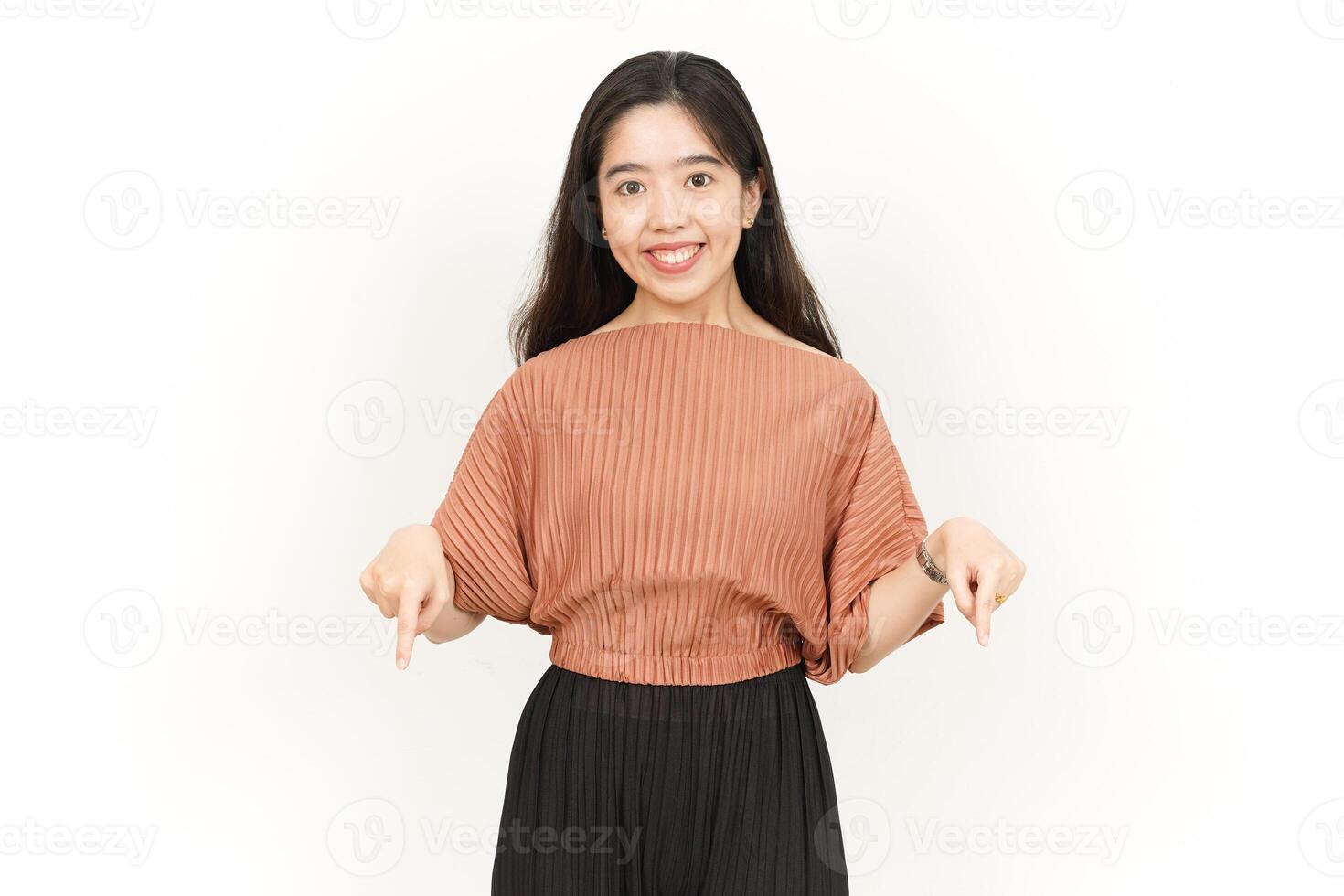 Presenting and Pointing Product Down Of Beautiful Asian Woman Isolated On White Background photo