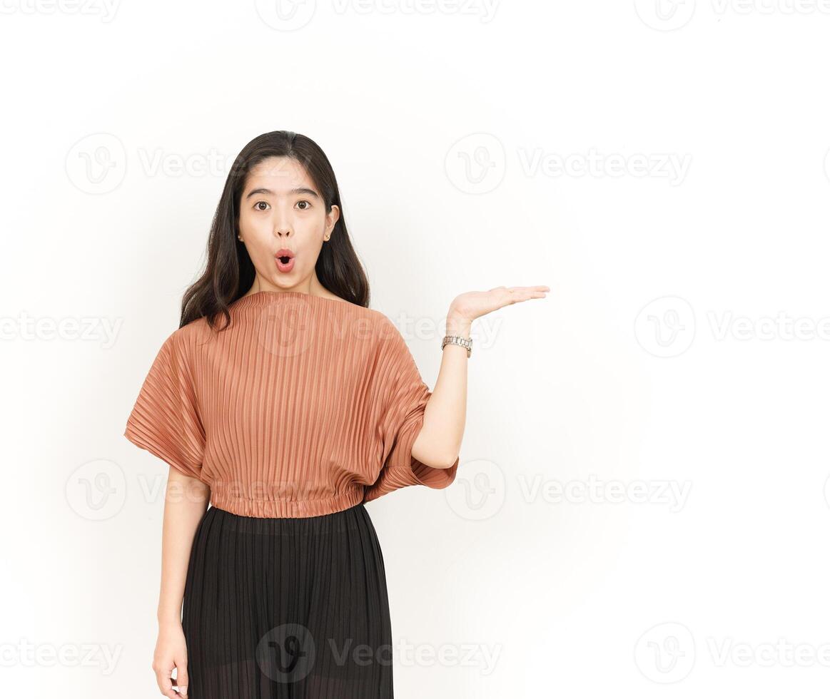 Showing and Presenting Product on Open Palm Of Beautiful Asian Woman Isolated On White Background photo