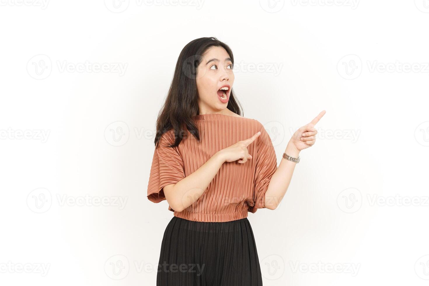 Showing Product and Pointing Side Of Beautiful Asian Woman Isolated On White Background photo