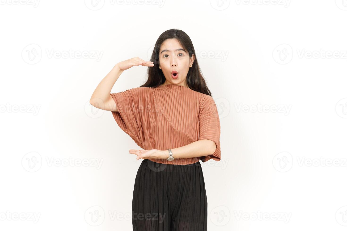 Measuring and Showing Big Sign Product Of Beautiful Asian Woman Isolated On White Background photo