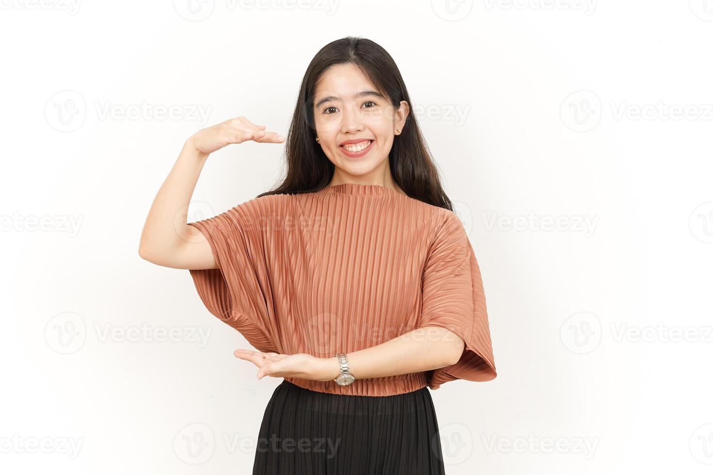 Measuring and Showing Big Sign Product Of Beautiful Asian Woman Isolated On White Background photo