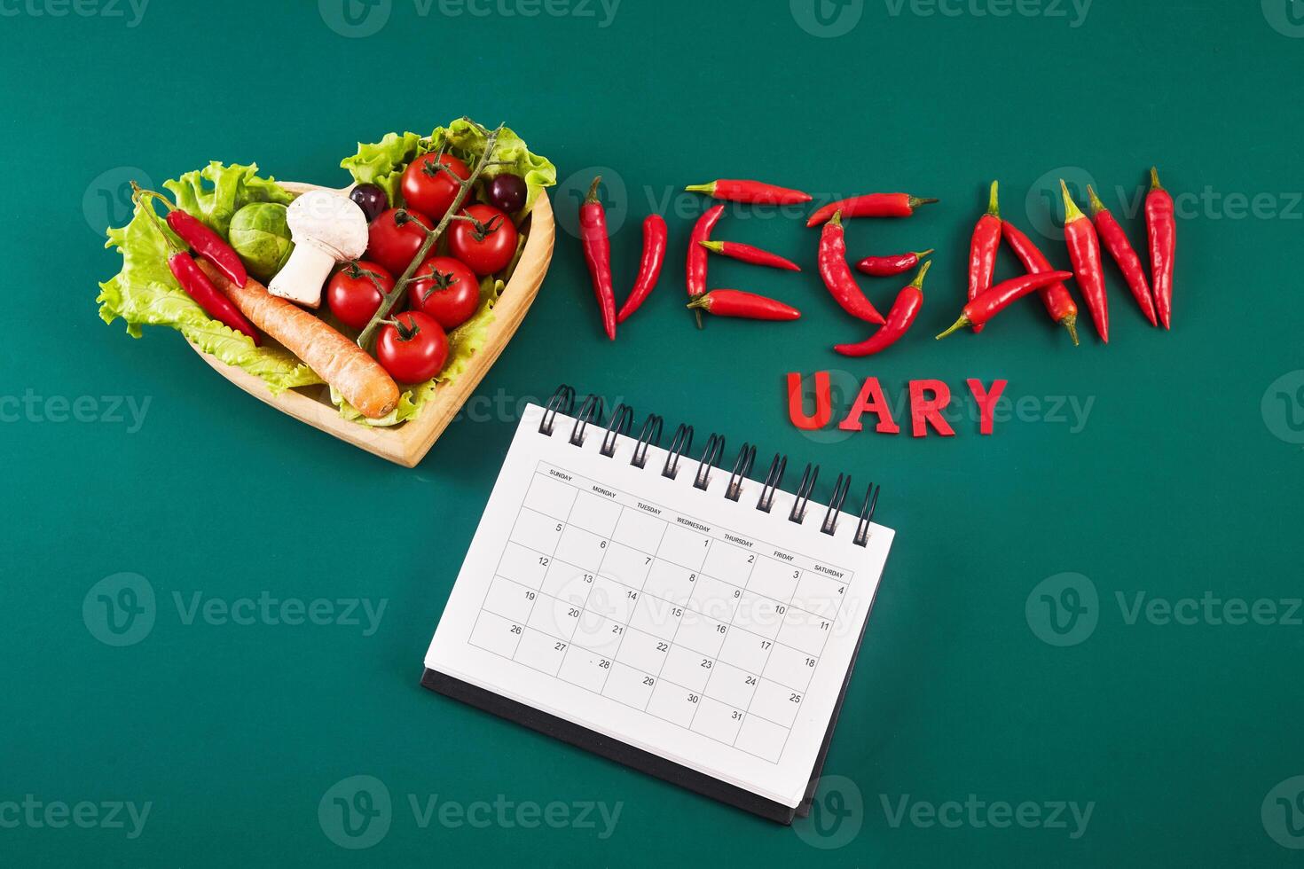 Vegetarian diet month in january called Veganuary. Top view filled veginuary calendar. photo