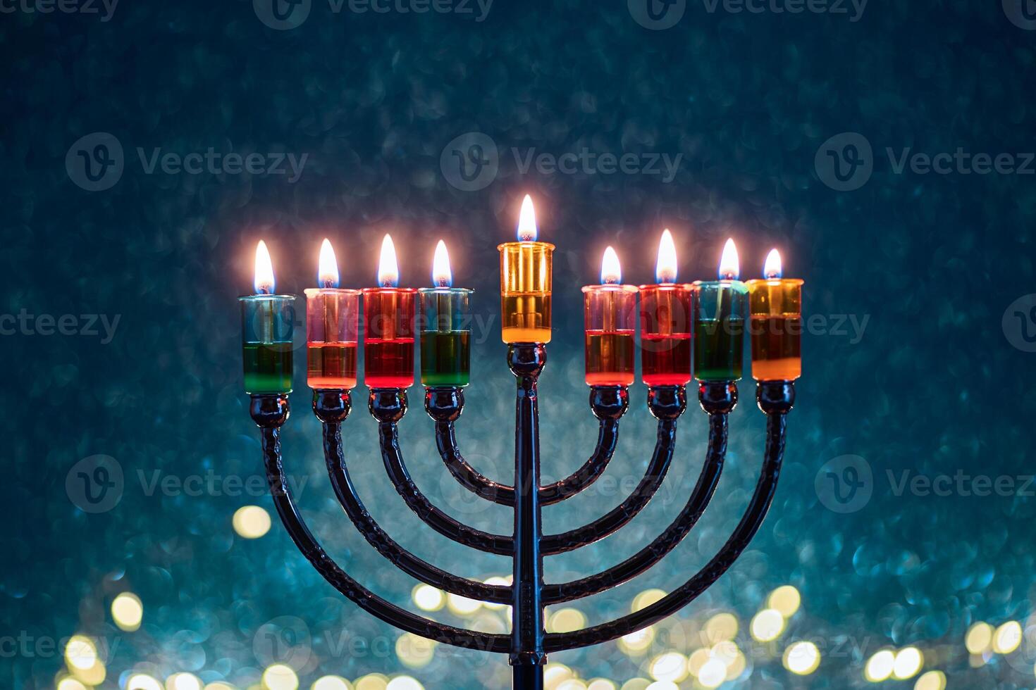 Hanukkah Menorah with burning candles on dark background with bokeh lights. photo
