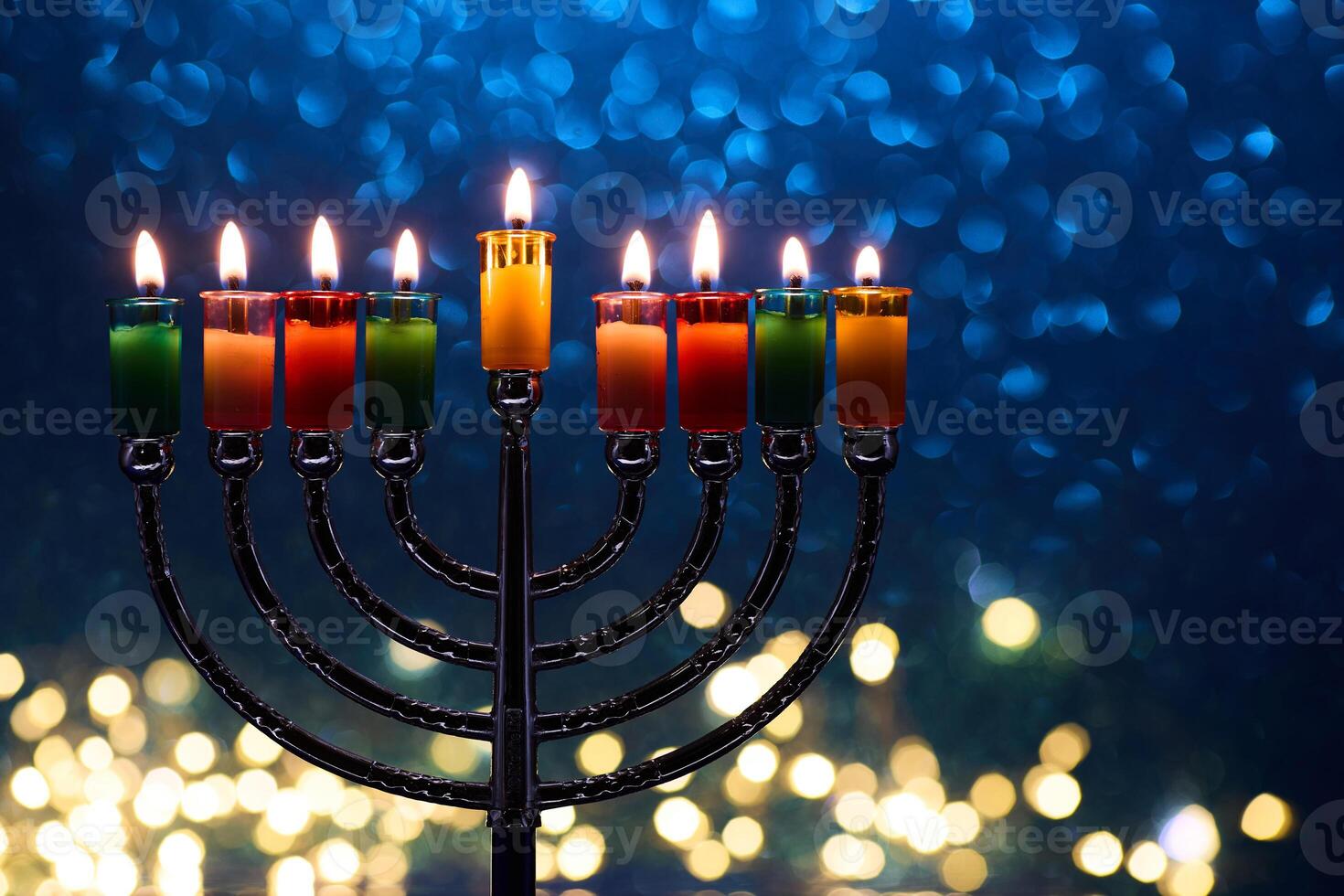 Hanukkah Menorah with burning candles on dark background with bokeh lights. photo