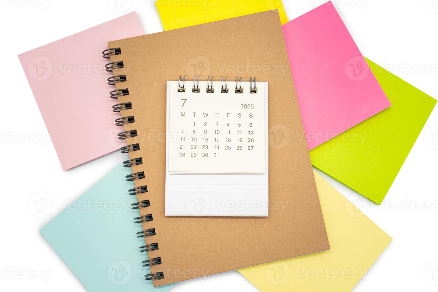 Simple desk calendar for JULY 2025 with office supplies. Calendar concept with copy space. 2025 JUL calendar. photo