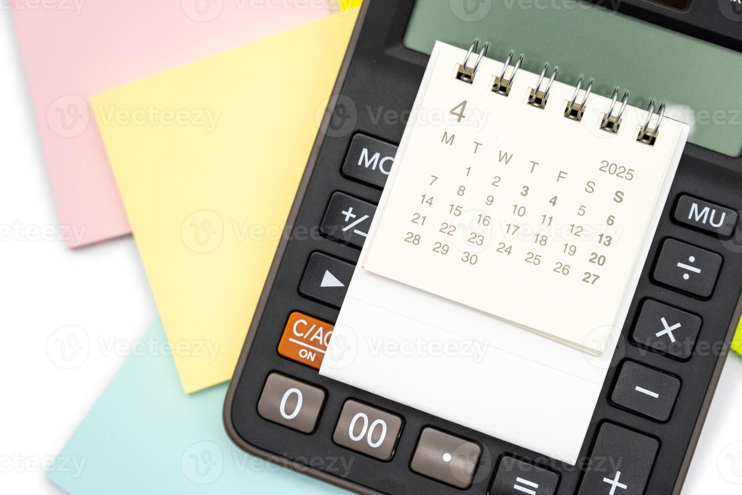 Simple desk calendar for APRIL 2025 on calculator. Calendar concept with copy space. 2025 APR calendar. photo