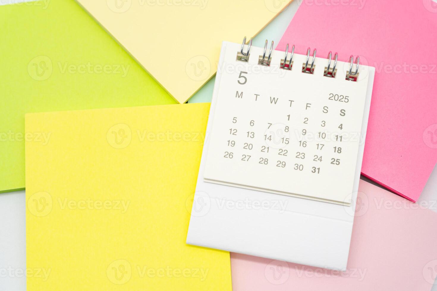 Simple desk calendar for MAY 2025 with office supplies. Calendar concept with copy space. 2025 MAY calendar. photo