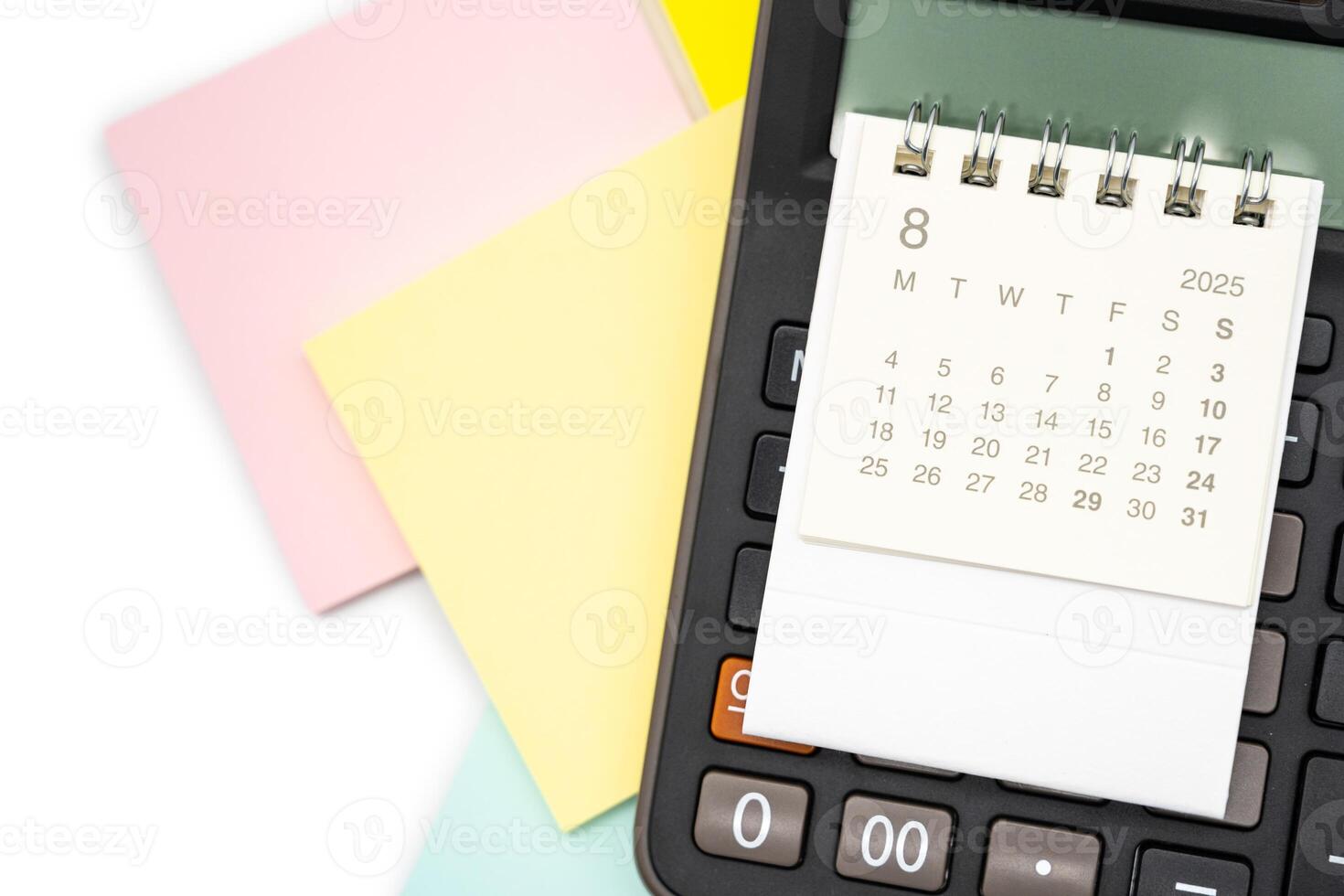 Simple desk calendar for AUGUST 2025 on calculator. Calendar concept with copy space. 2025 AUG calendar. photo