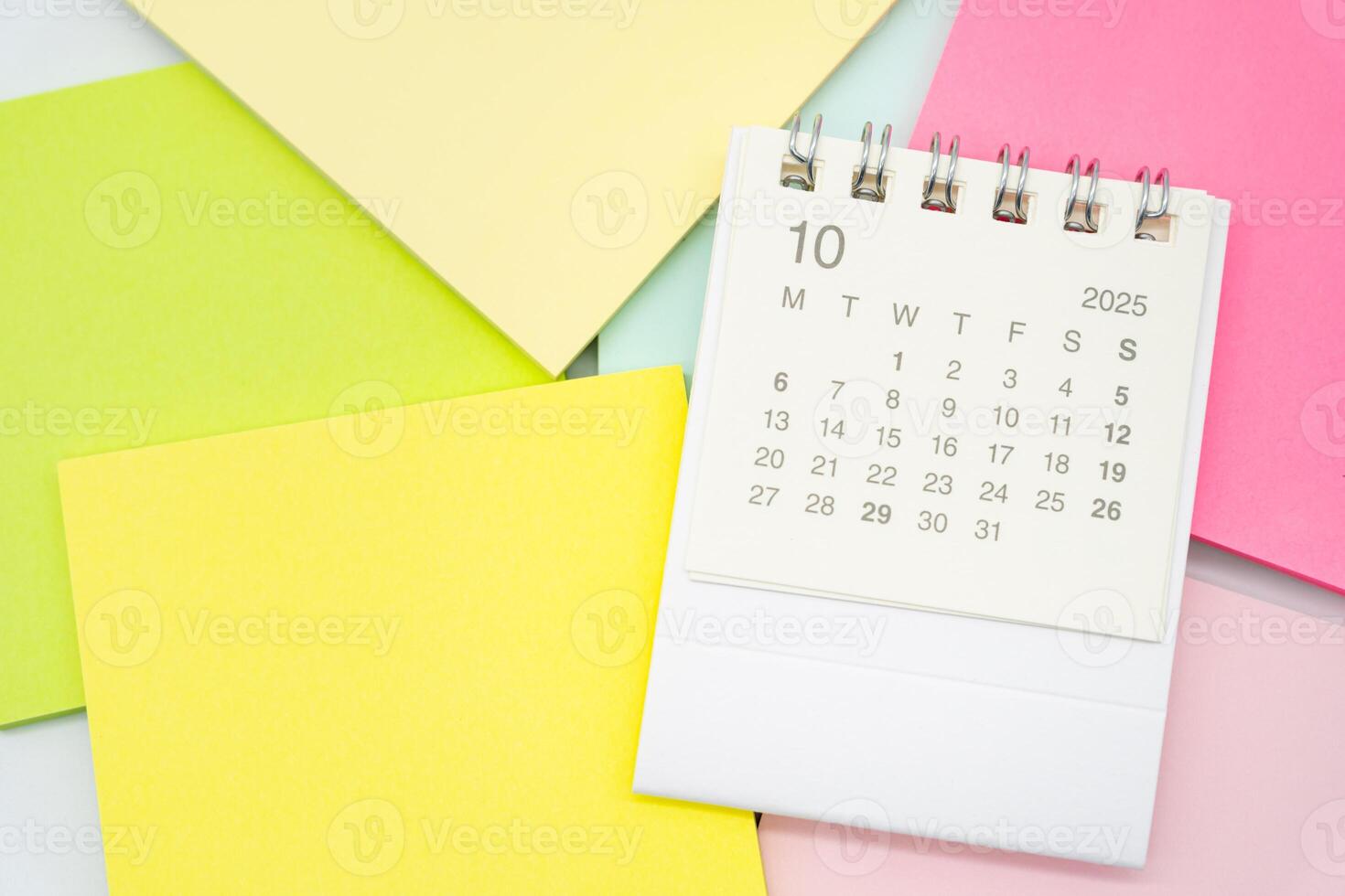 Simple desk calendar for OCTOBER 2025 with Sticky note. Calendar concept with copy space. 2025 OCT calendar. photo