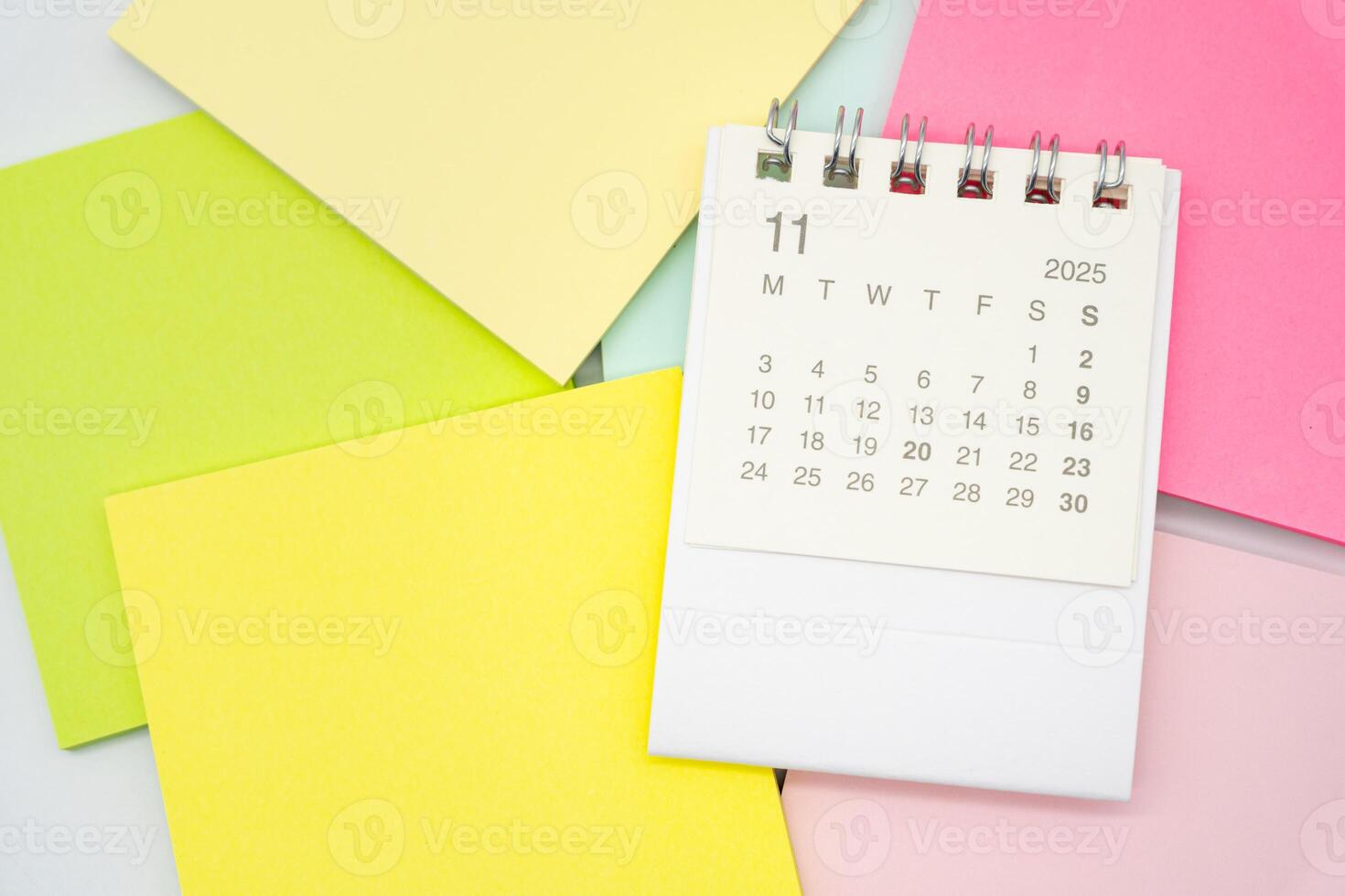 Simple desk calendar for NOVEMBER 2025 with Sticky note. Calendar concept with copy space. 2025 NOV calendar. photo