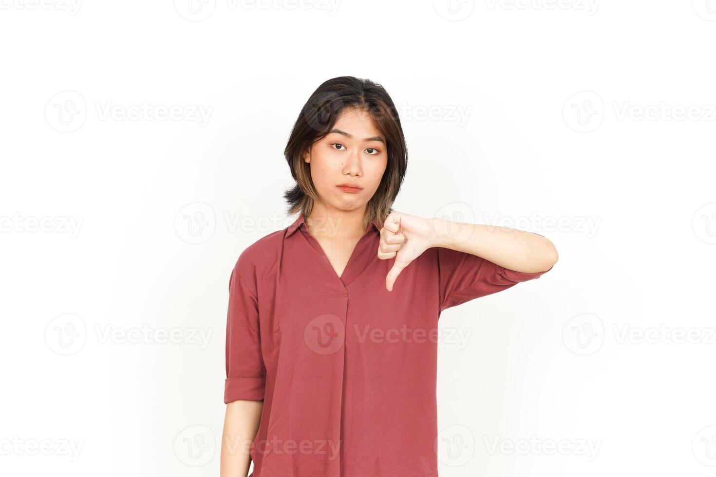 Showing Thumbs Down Of Beautiful Asian Woman Isolated On White Background photo