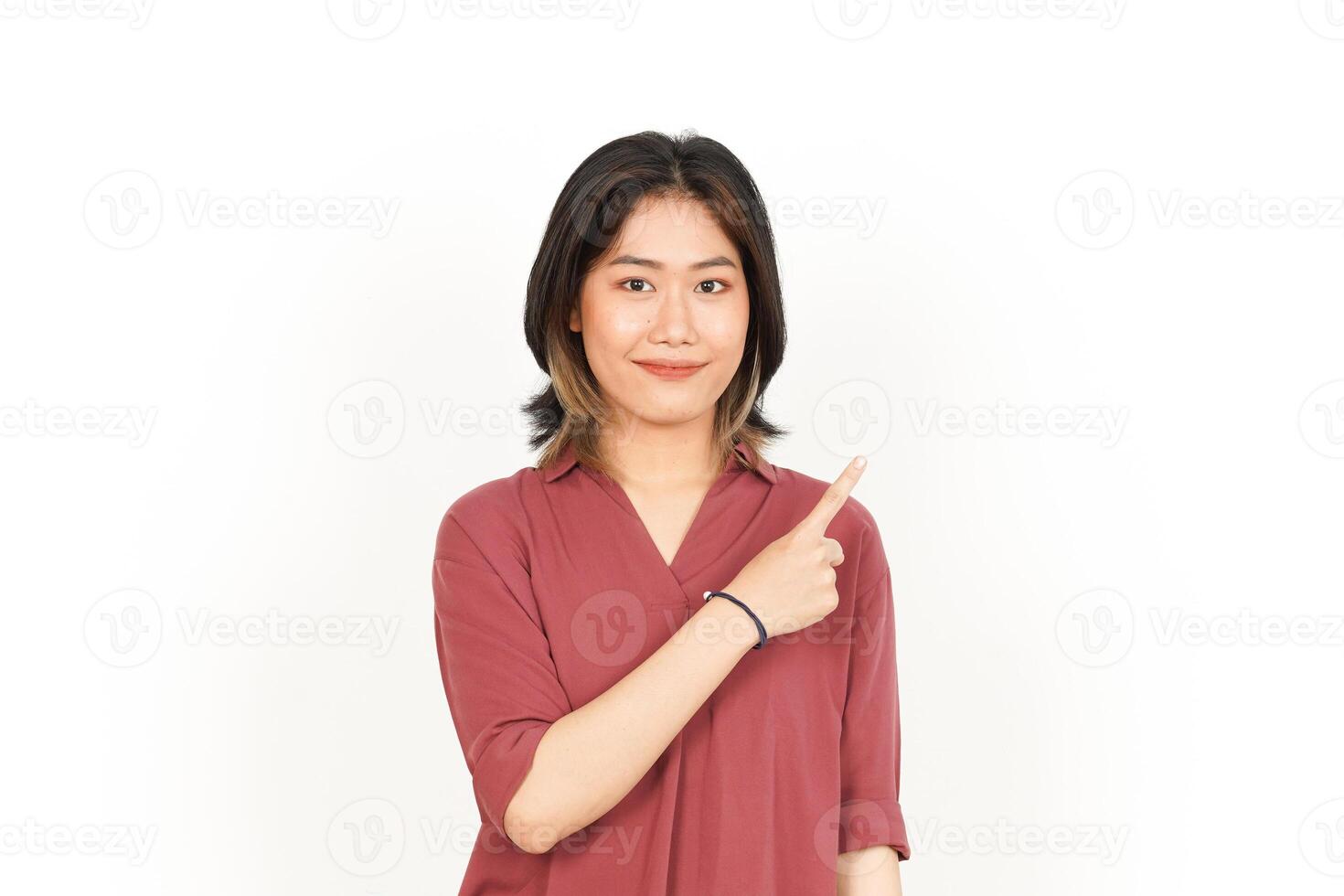 Showing Product and Pointing Side Of Beautiful Asian Woman Isolated On White Background photo