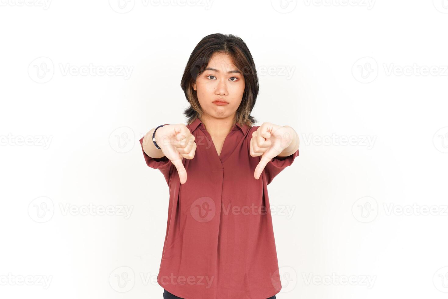 Showing Thumbs Down Of Beautiful Asian Woman Isolated On White Background photo