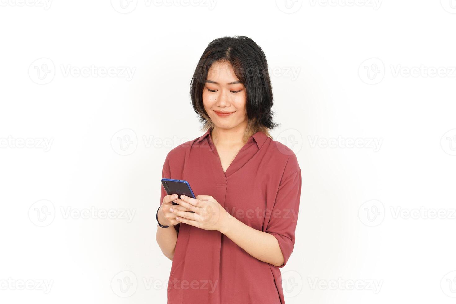 Holding and Using Smartphone Of Beautiful Asian Woman Isolated On White Background photo