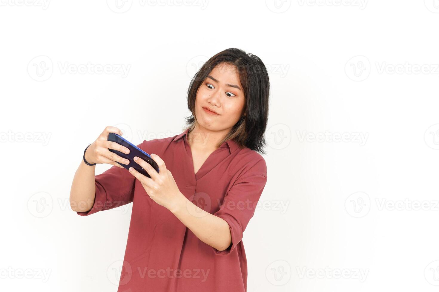 Playing Games On Smartphone With Angry Face for Lose Game Of Beautiful Asian Woman Isolated On White Background photo