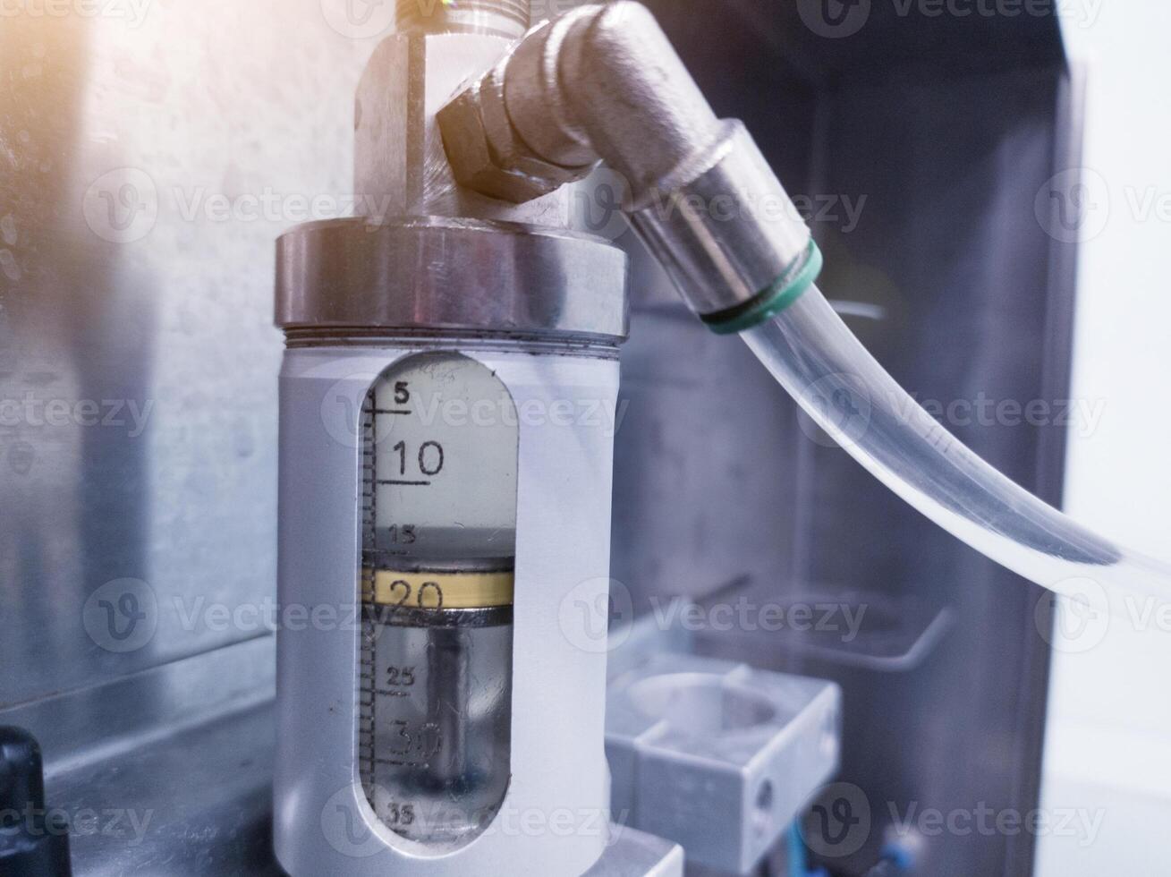 Close up the piston cylinder tube contains medicinal liquid for spray vaccine for hatching chicks. photo