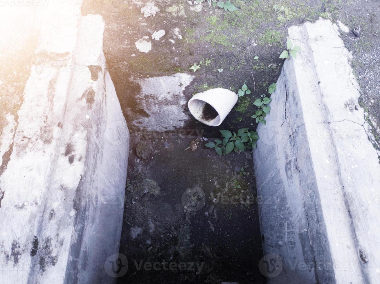 Control reservoir for draining water from building roof gutters. photo