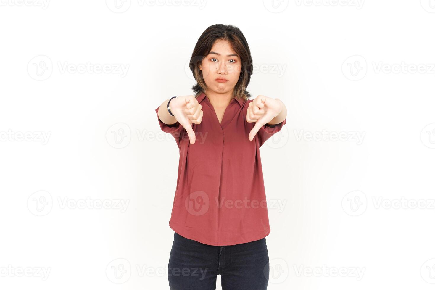 Showing Thumbs Down Of Beautiful Asian Woman Isolated On White Background photo