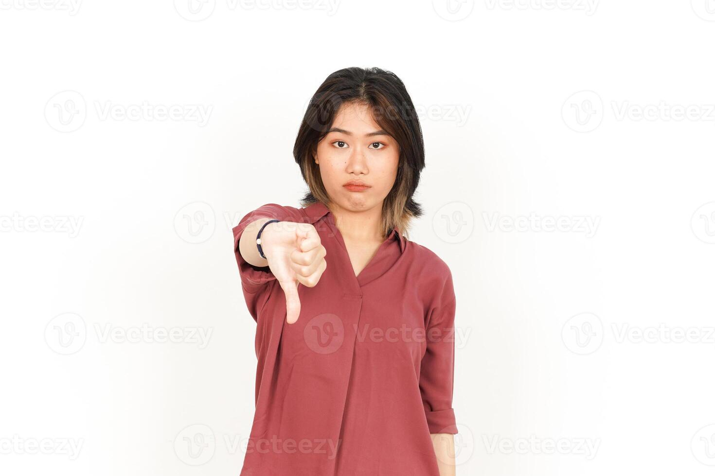 Showing Thumbs Down Of Beautiful Asian Woman Isolated On White Background photo