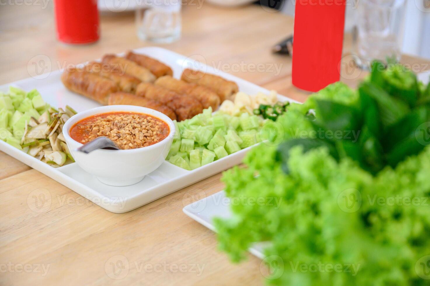 Nam-Neaung of Vietnamese food with roll pork, vegetable and sauce photo