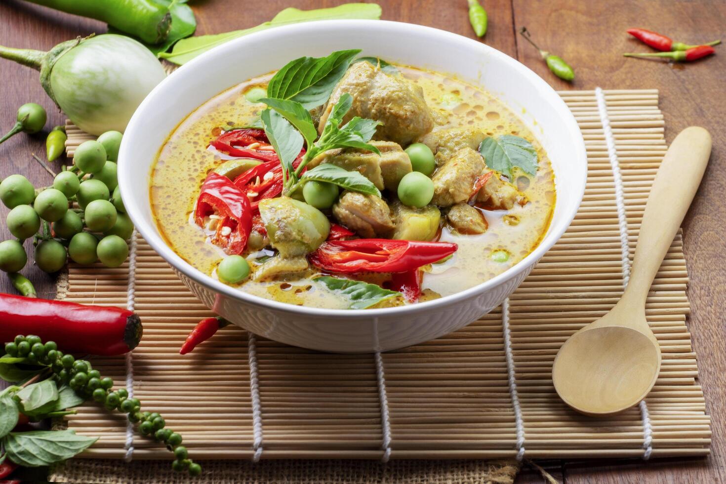 Chicken Green Curry or pork Asian food Thai food on a bowl of soup with a mixture of herbs, vegetables and pepper spices. photo