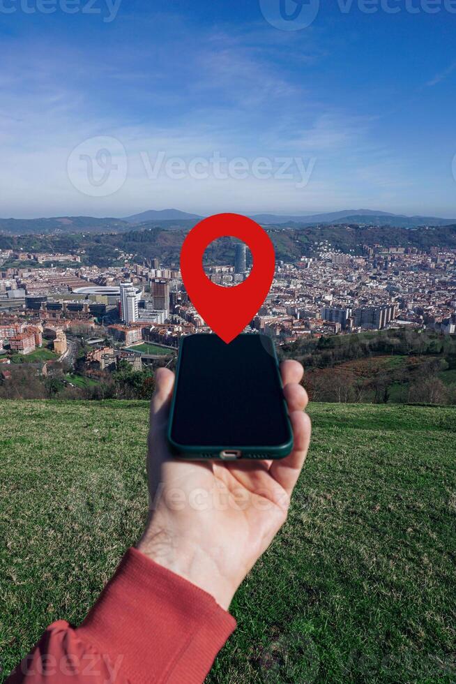 hand holding a smart phone searching location, with a gps symbol photo