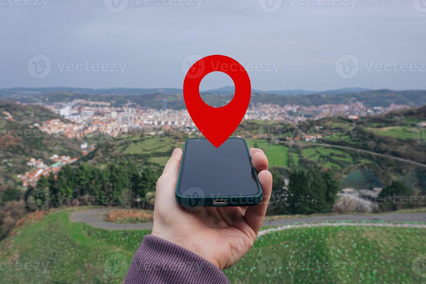 hand holding a smart phone searching location, with a gps symbol photo