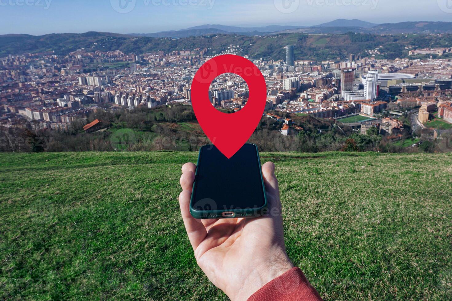 hand holding a smart phone searching location, with a gps symbol photo