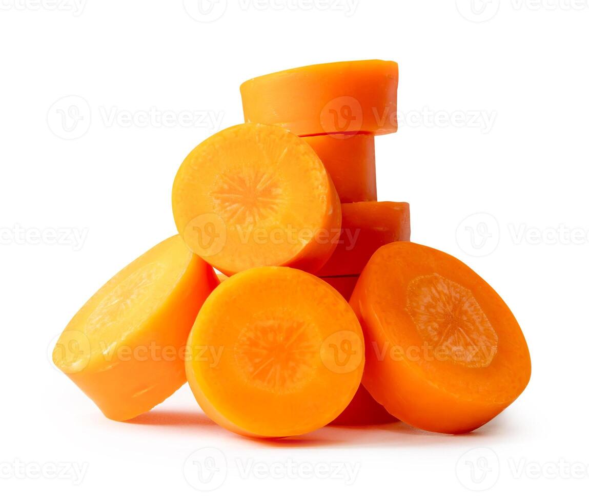 Fresh orange carrot slice in circle shape in pile isolated on white background with clipping path photo