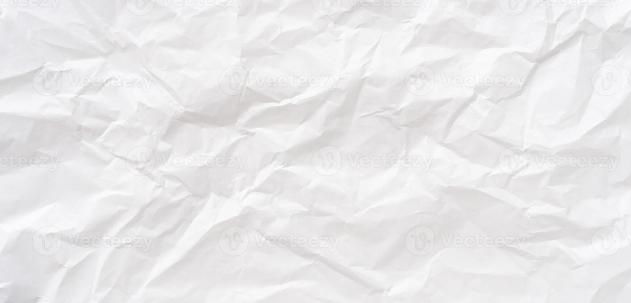 Wrinkled or crumpled white stencil paper texture used for wrinkled or crumpled white paper background texture in decorative art work Top view and full frame photo