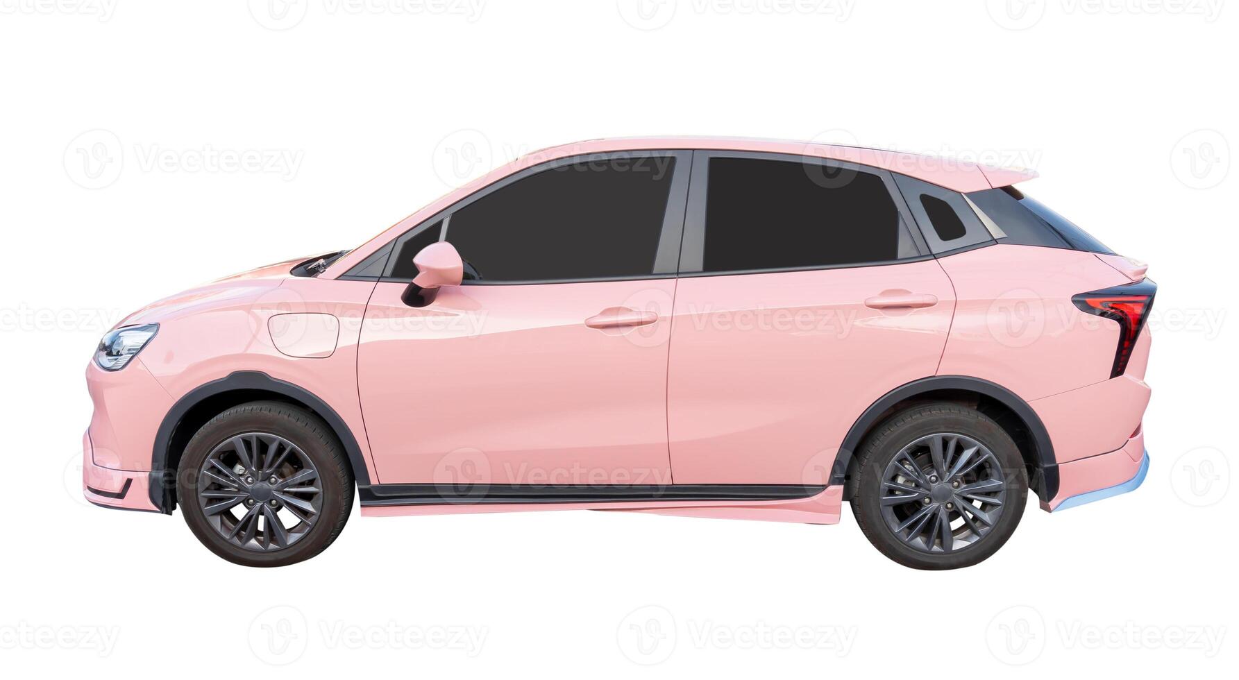 Side view of pink mini or small electric hatchback car isolated on white background with clipping path photo