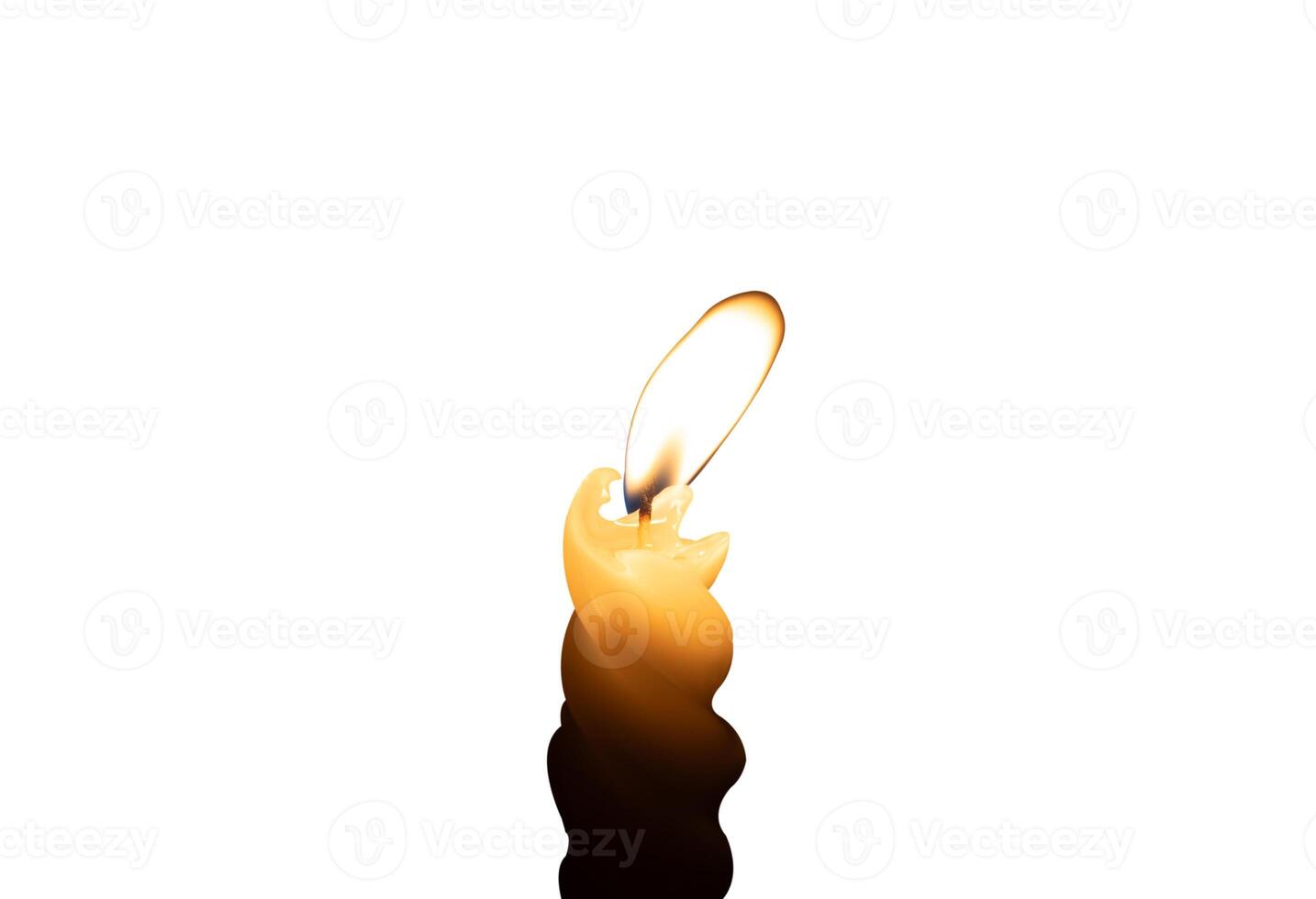 A small yellow spiral candle with candlelight isolated on white background with clipping path photo